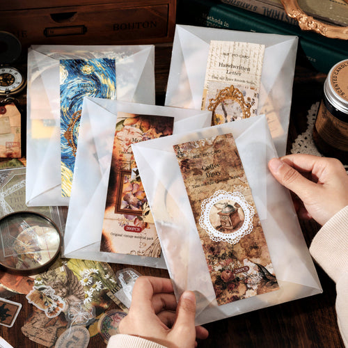 200-piece vintage ephemera pack with stamps, tickets and typewriter notes in tracing paper envelope