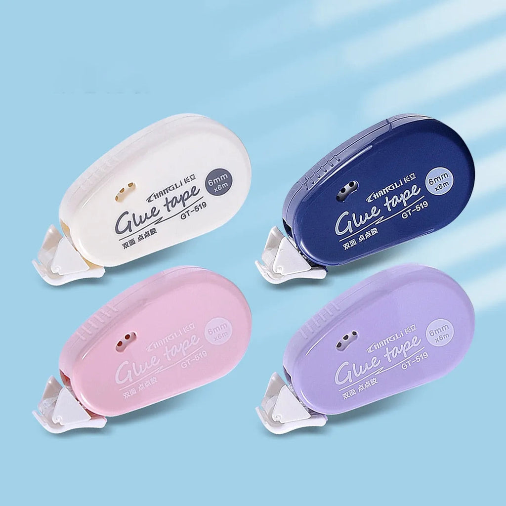 Four glue tape rollers flat lay in white, navy, pink and lavender