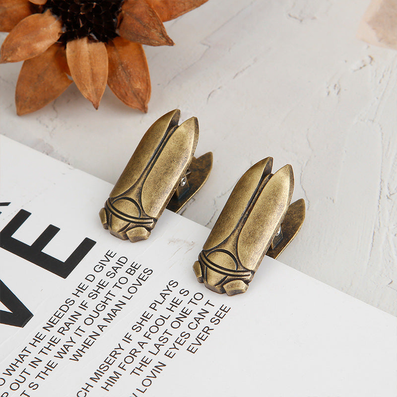 Set of 2 Aged Antique Bronze vintage cicada journal clips holding a book page flat. Essential junk journal tools for taming thick notebooks.