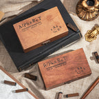 Wooden alphabet stamp box paired with a black ink pad on a vintage desk setup