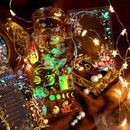 Aesthetic flat lay of vintage celestial and floral junk journal supplies including stickers and papers