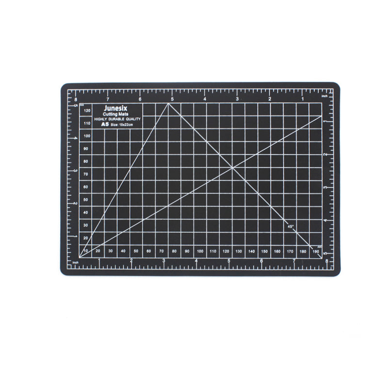 Black A5 self-healing cutting mat with white grid lines and inch rulers