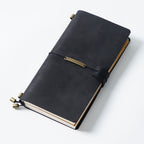 Black crazy horse leather traveler's notebook with elastic band and tassel