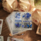 Image of blue floral vintage stickers with butterfly and Be Original Forever text, transparent PET waterproof pieces for dark academia journal decoration
