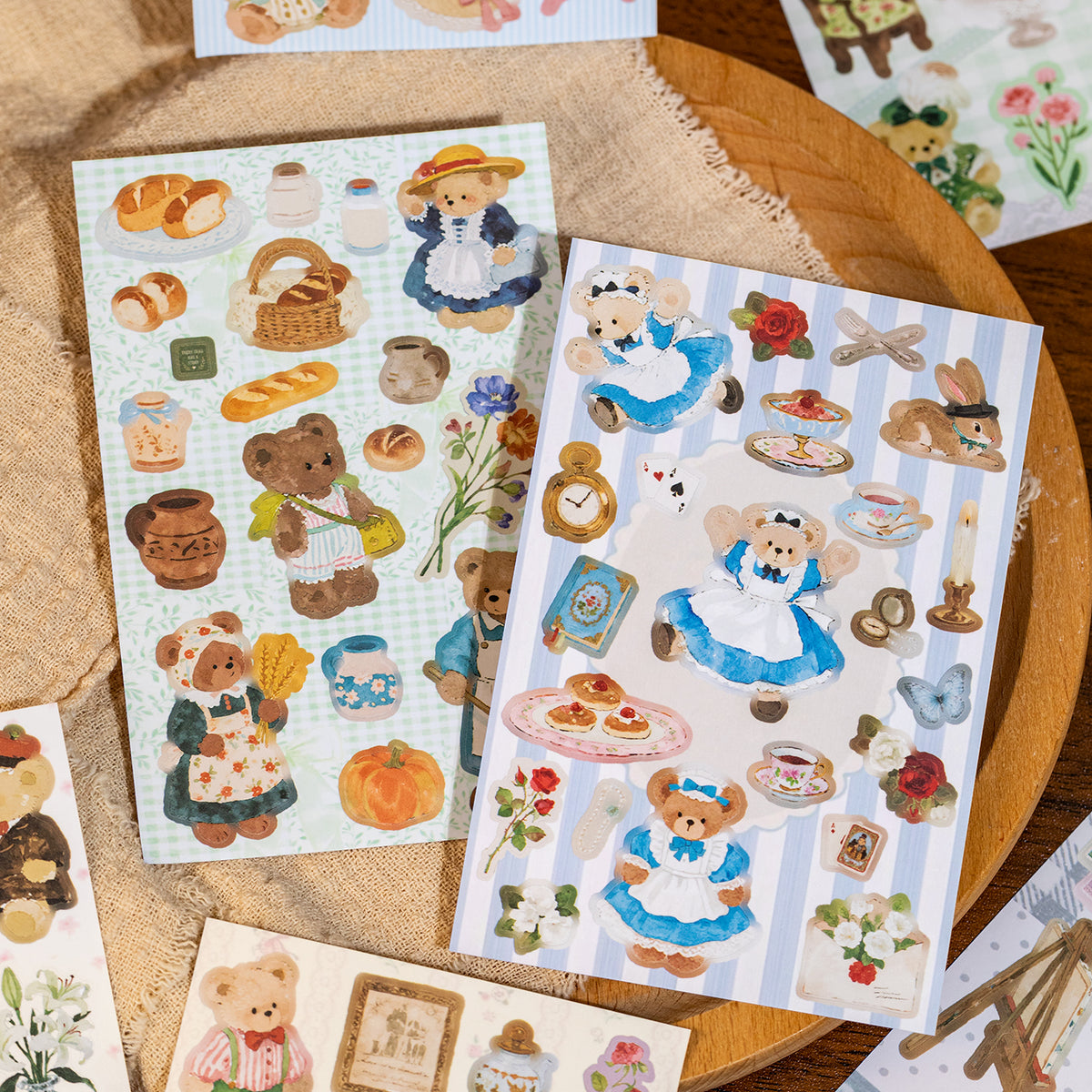 Blue and white teddy bear sticker sheets scattered with bow and frame designs