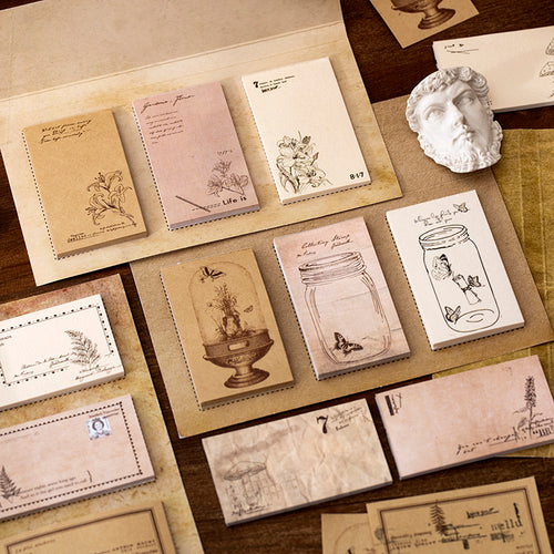 Close-up of botanical sticky notes showing vintage plant designs with kraft and washi paper textures
