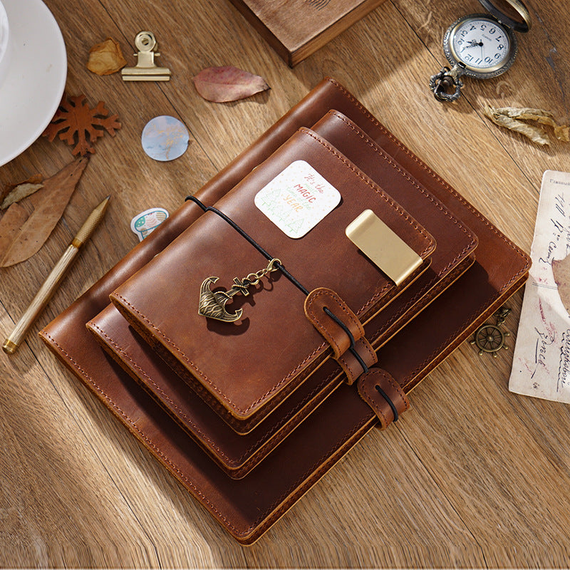 Refillable brown crazy horse leather ring binder journal with cord closure and brass charm