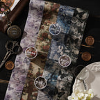Butterfly washi tape beside pocket watches and dark décor