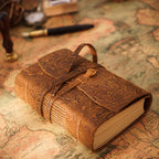 Carved brown leather sketchbook with embossed tooled pattern and cord