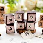 Complete collection of six vintage cat rubber stamps arranged on a green botanical background, featuring beech wood handles and whimsical black cat illustrations