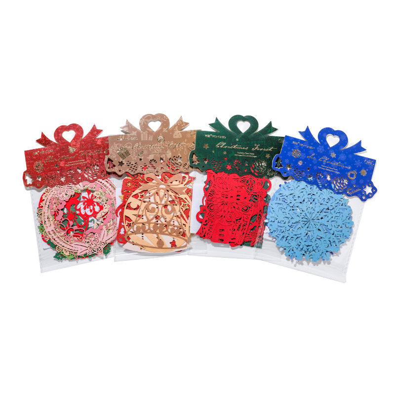 Red gold and blue laser cut Christmas gift boxes paper cutouts on white