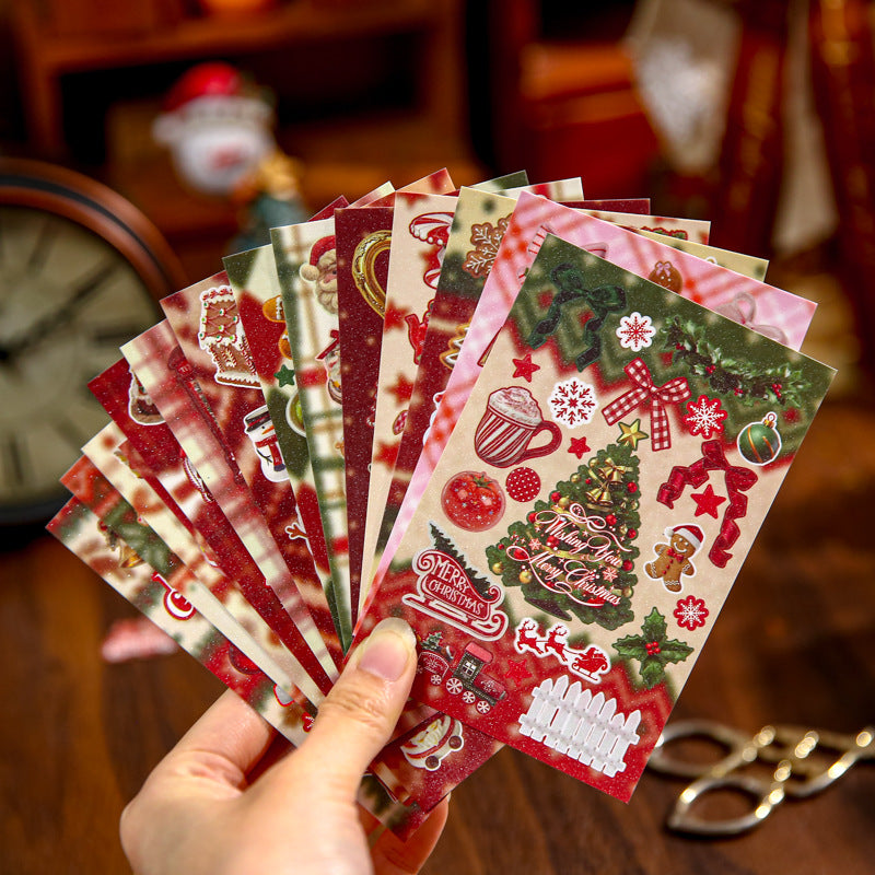 Hand fanning glitter Christmas sticker sheets - red and green holiday designs with trees, gifts and snowmen
