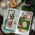 Christmas junk journal spread decorated with letter stickers, washi tape and a postcard