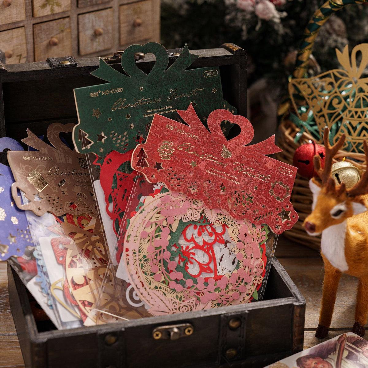 Christmas laser cut paper sets with gold foil header cards in wooden box