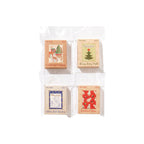 Four styles of Christmas letter sticker boxes flat lay on white background