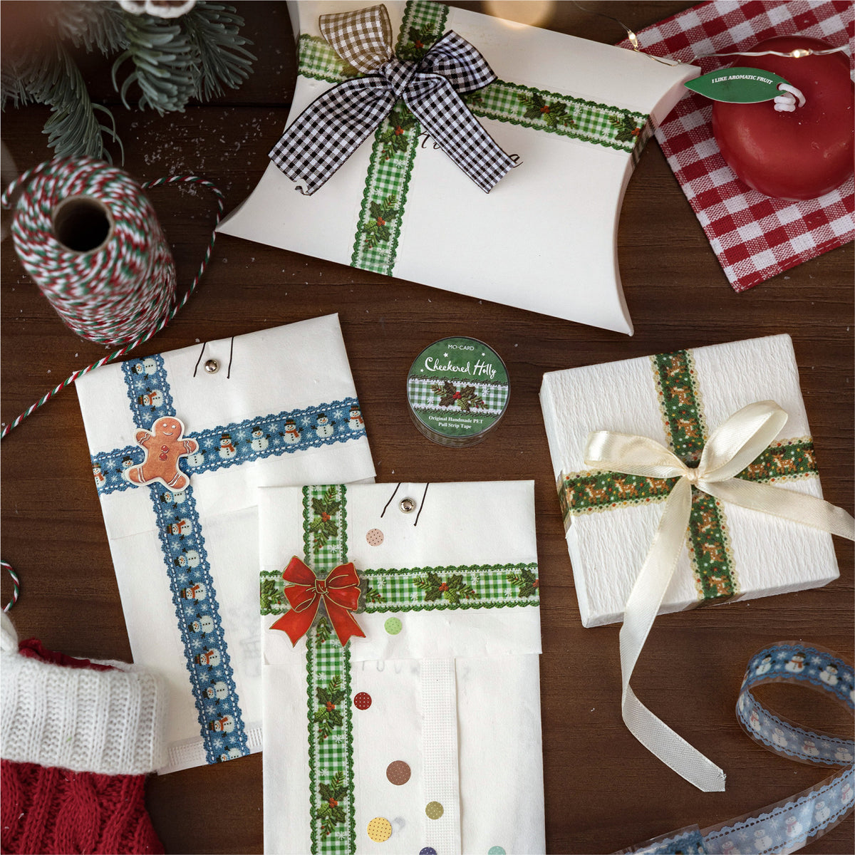Christmas PET tapes beside gift-wrapped packages with plaid ribbon and wax seals