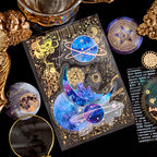 Close up of holographic gold foil stickers featuring astronauts planets and stars on transparent PET