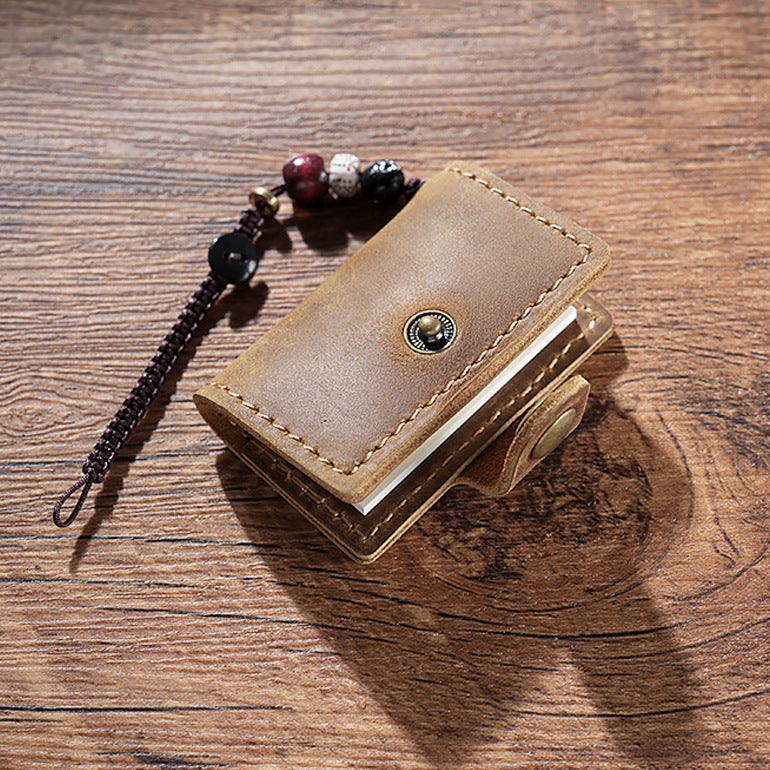 Coffee mini leather notebook charm with beaded cord on wood