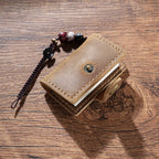 Coffee mini leather notebook charm with beaded cord on wood