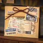 Vintage coffee notepads and strips used as gift wrapping embellishments tied with twine, showing receipt style prints, barcode labels, and coffee cup illustrations on kraft paper