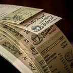 Stack of vintage coffee tear-off notepads showing vanilla balanced and process printed designs, retro cafe typography and cup illustrations on lightweight paper strips