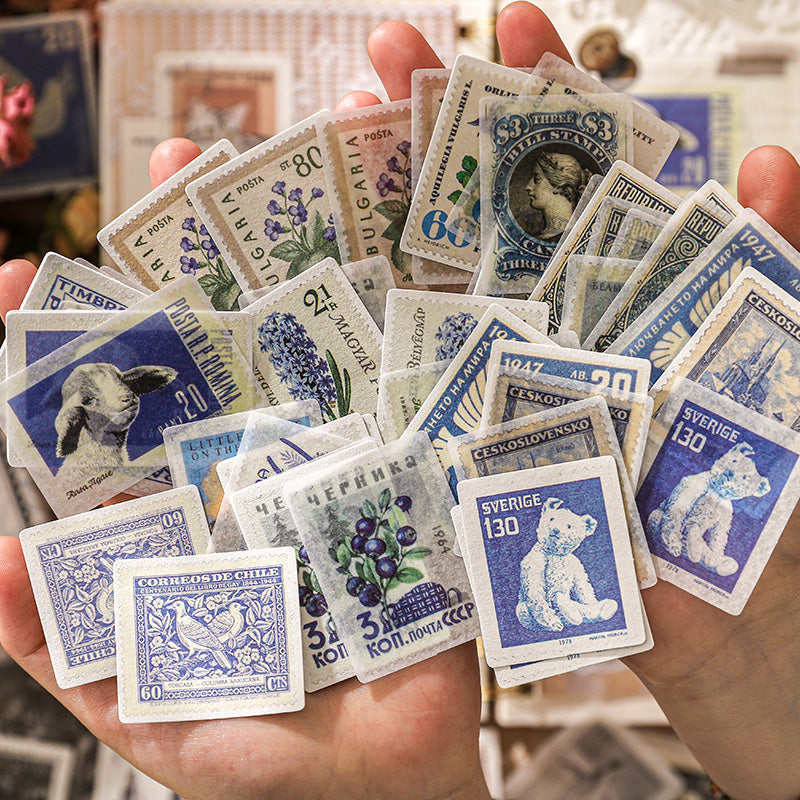 Color-curated vintage postage stamp stickers showing retro ephemera designs in elegant color palettes