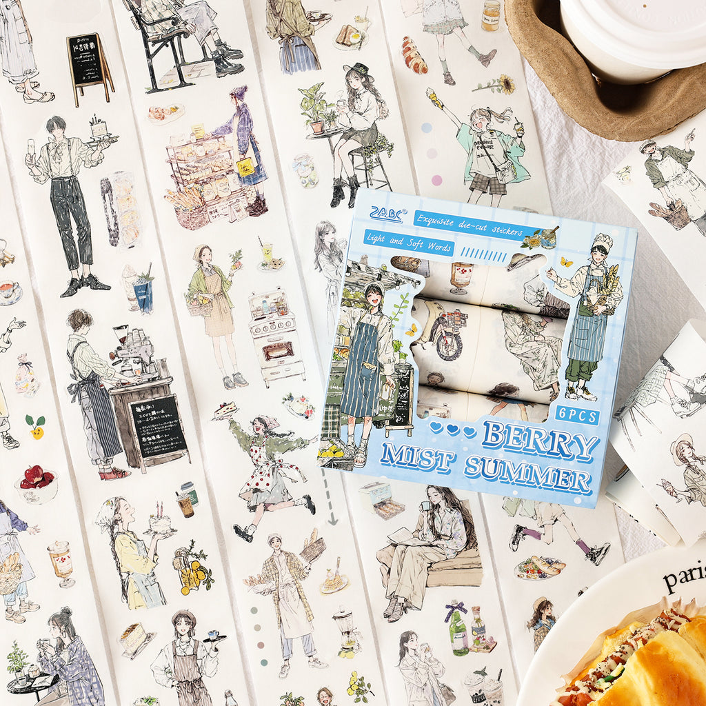 Variant image for the Cozy Café aesthetic character die-cut washi tape set. Features 6 rolls of wide tape displaying girls baking, coffee shop scenes, and relaxing everyday lifestyle illustrations.