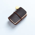 Dark brown crazy horse leather mini traveler's notebook charm with elastic band and vintage metal clasp