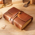 Crazy horse brown pocket leather sketchbook closed with wrap cord
