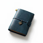 Distressed Indigo full-grain leather pocket sketchbook, a unique blue rustic travel journal for artists and urban explorers.