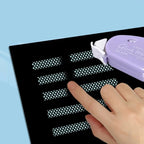 Finger pressing dot-patterned adhesive strip applied by glue tape roller on black paper