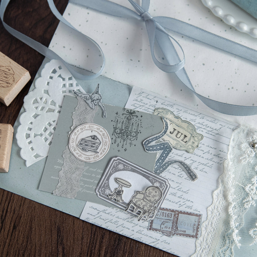 Wood stamps with ribbon and blue-toned stamped ephemera
