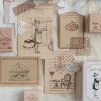 Cream paper scene with kraft boxes, wood stamps, and layered stamped tags