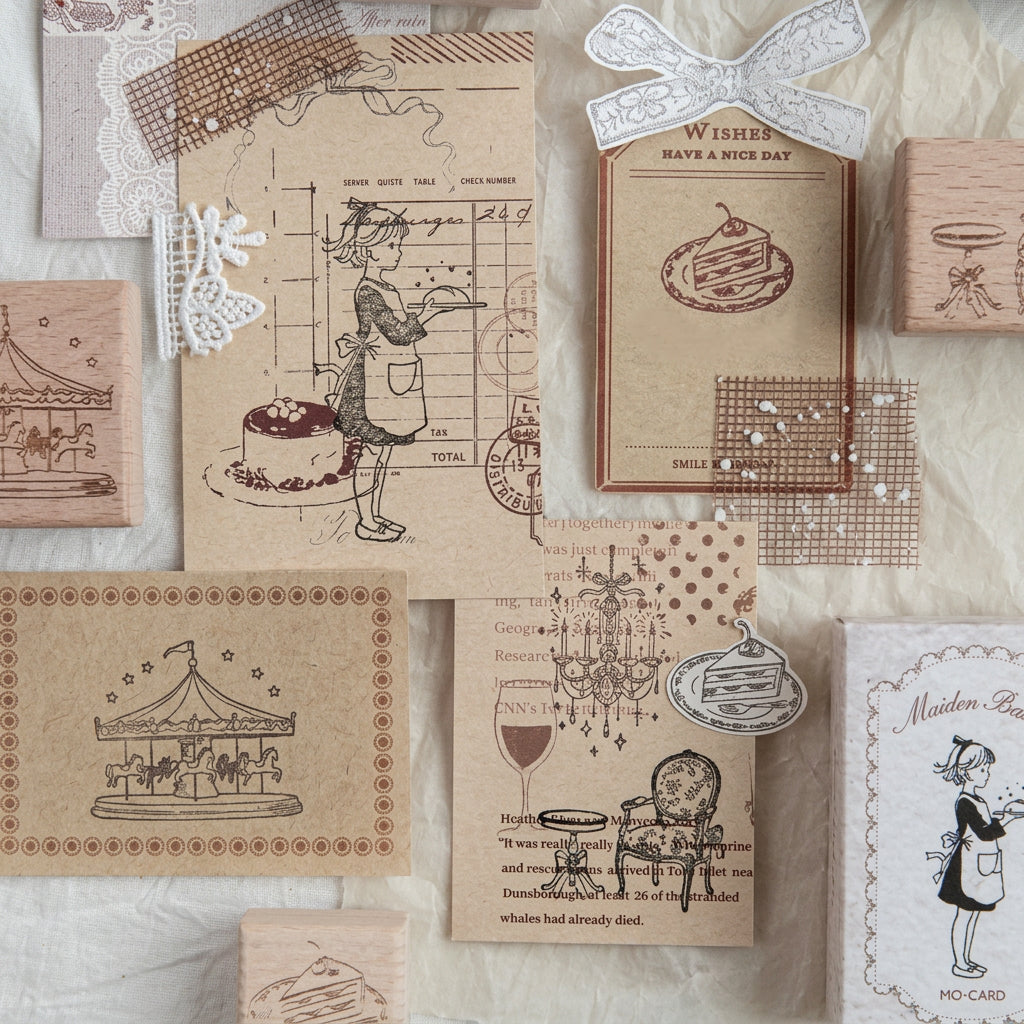 Cream paper scene with kraft boxes, wood stamps, and layered stamped tags
