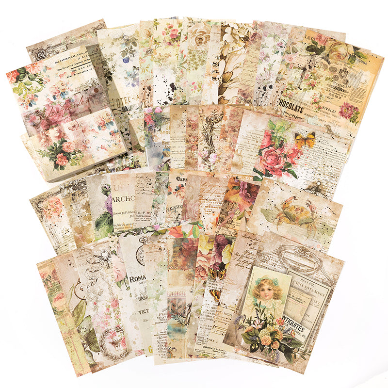Fanned vintage botanical paper sheets with pressed roses, butterflies, and floral illustrations in soft pink and sage tones on a white background.