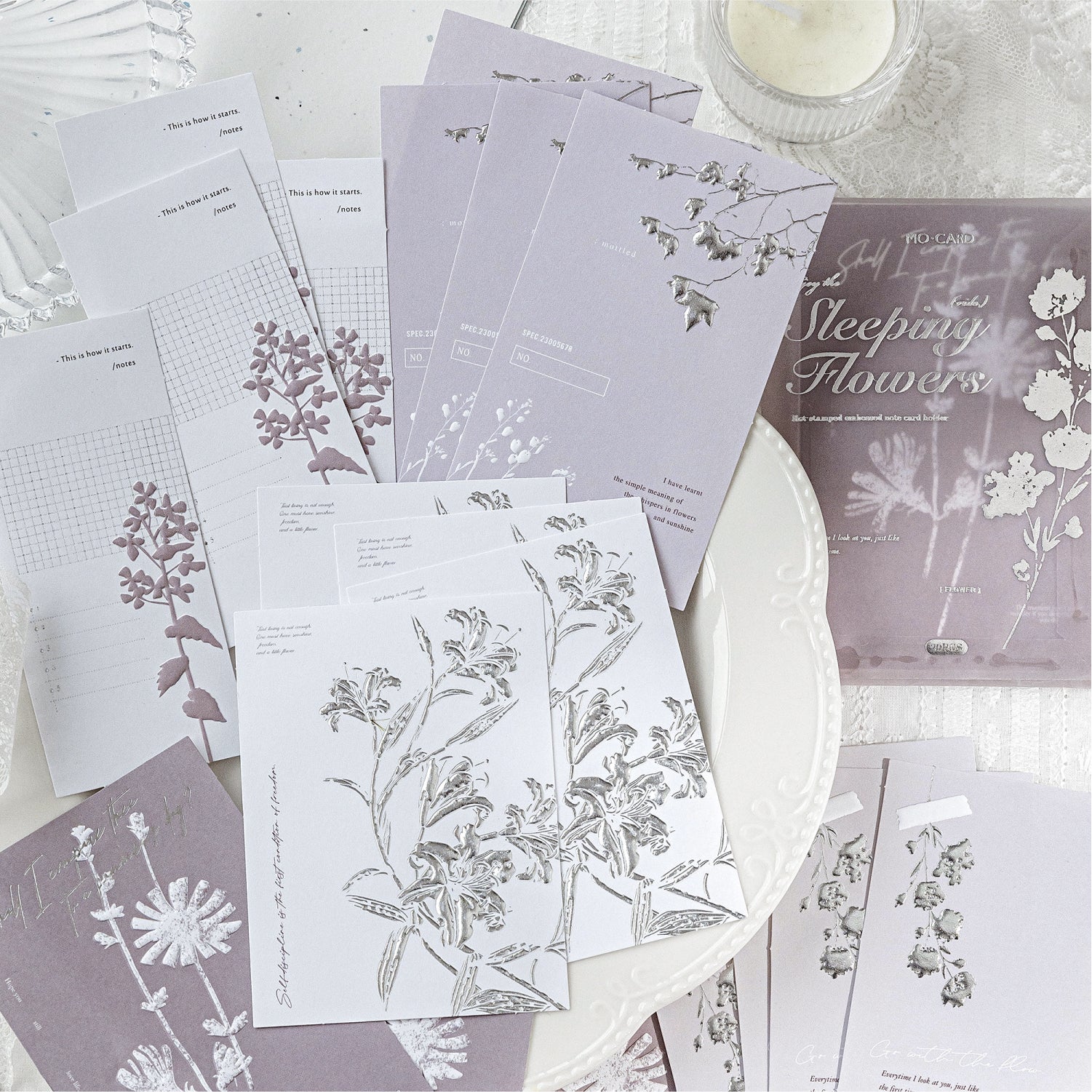 Close-up of silver foil stamping and raised relief embossing on premium paper