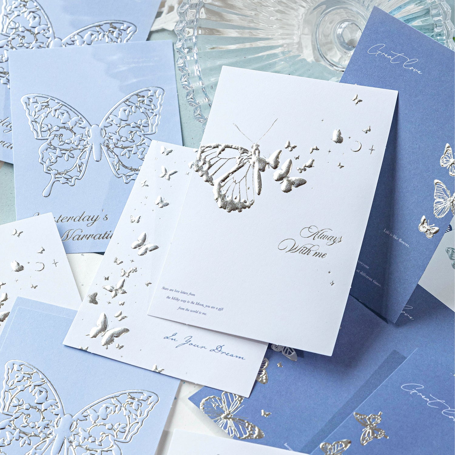 Elegant ephemera pack packaging with translucent tracing paper sleeve
