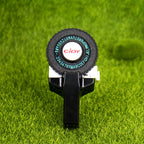 Black embossing label maker on grass background