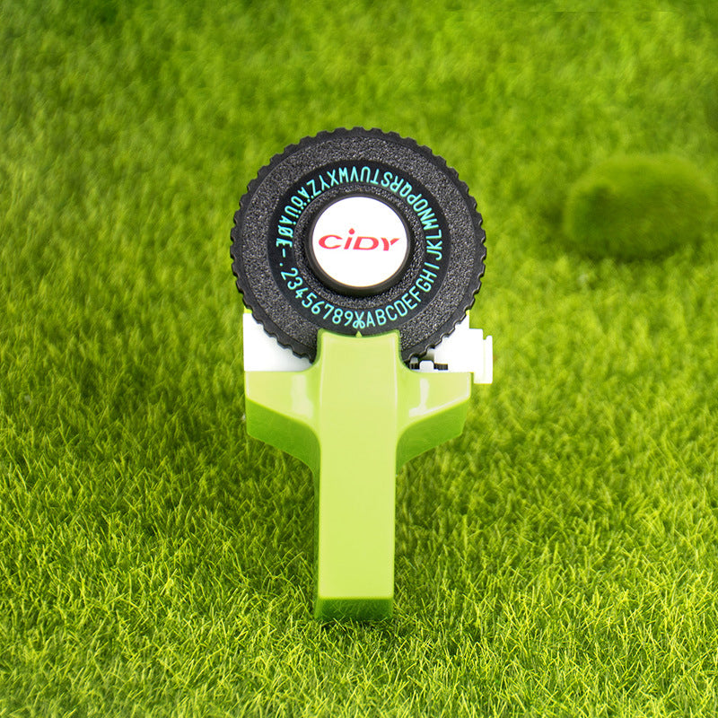 Grass green embossing label maker on grass background