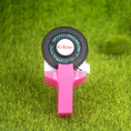 Pink embossing label maker on grass background