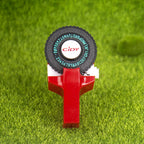 Red embossing label maker on grass background
