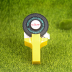 Yellow embossing label maker on grass background