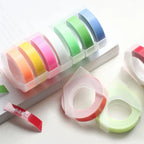 Colorful embossing tape refill rolls in pink, green, blue and orange for 9mm label makers