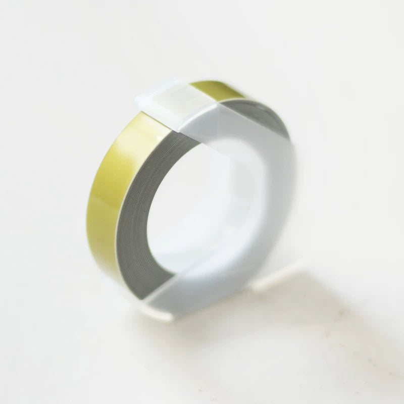Gold metallic embossing tape refill roll for manual label makers
