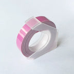 Light pink embossing tape refill roll for manual label makers