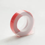 Orange embossing tape refill roll for manual label makers
