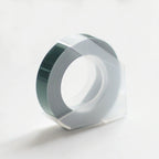 Purple embossing tape refill roll for manual label makers