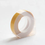 Yellow embossing tape refill roll for manual label makers