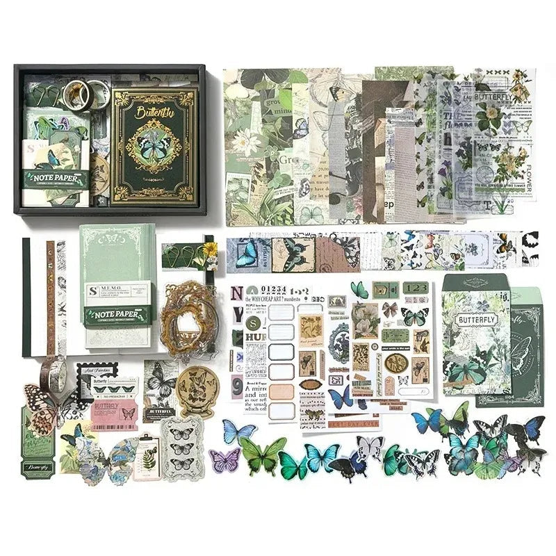 Main image for the 'Emerald Forest' Botanical Green Nature Scrapbook Kit variant, featuring the green butterfly notebook, botanical stickers, vellum papers, and forest aesthetic washi tapes in an open gift box.