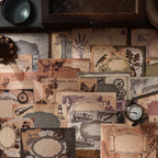 Vintage paper packs displayed on a shelf with clock and props